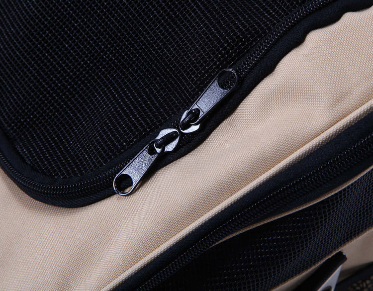 Close-up of FREDOPETS pet car bag zipper and fabric in beige and black color.
