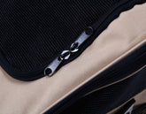 Close-up of FREDOPETS pet car bag zipper and fabric in beige and black color.